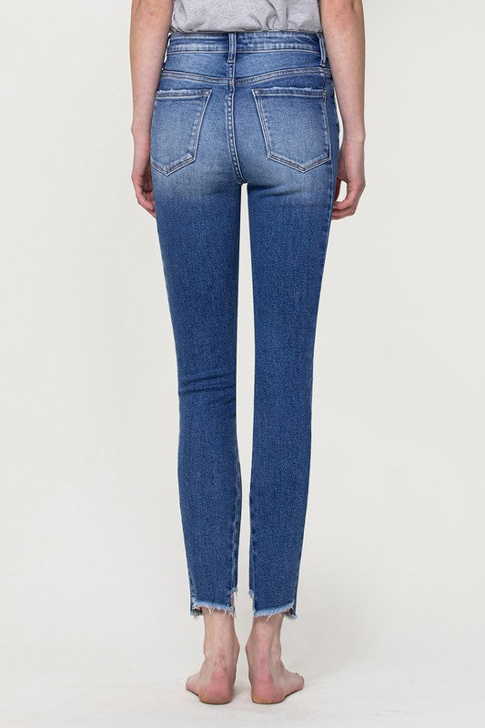 HIGH RISE SKINNY JEANS WITH HEM DETAIL