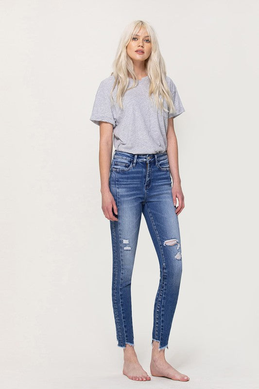 HIGH RISE SKINNY JEANS WITH HEM DETAIL